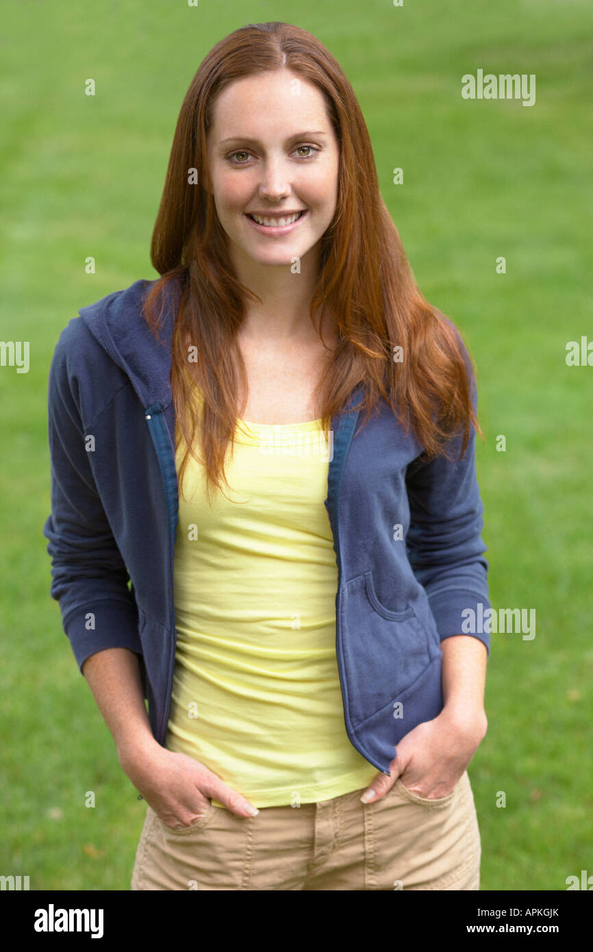 Young woman with hands in pockets (portrait Stock Photo - Alamy