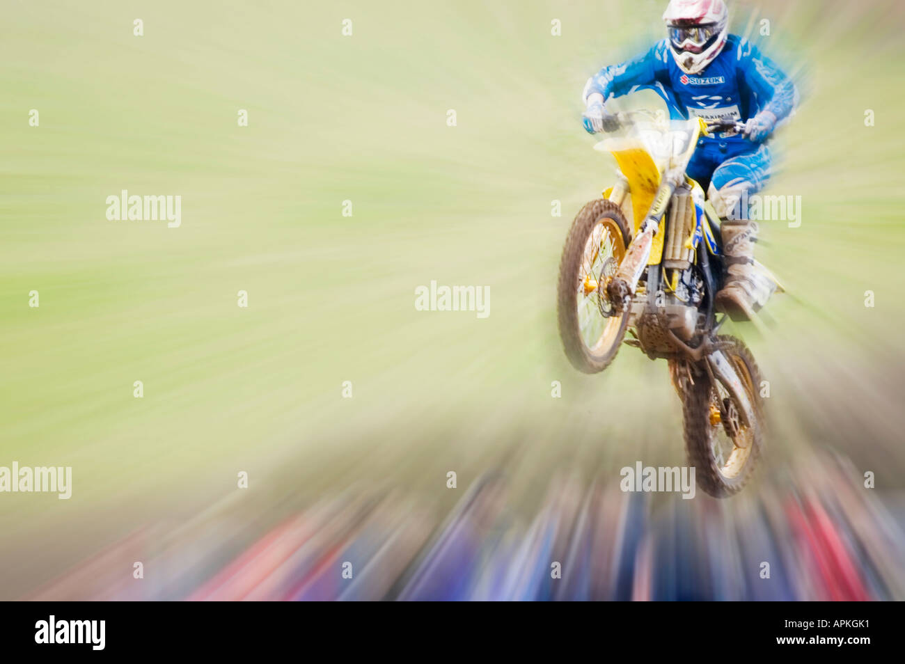 Motocross competitor flies through air Stock Photo
