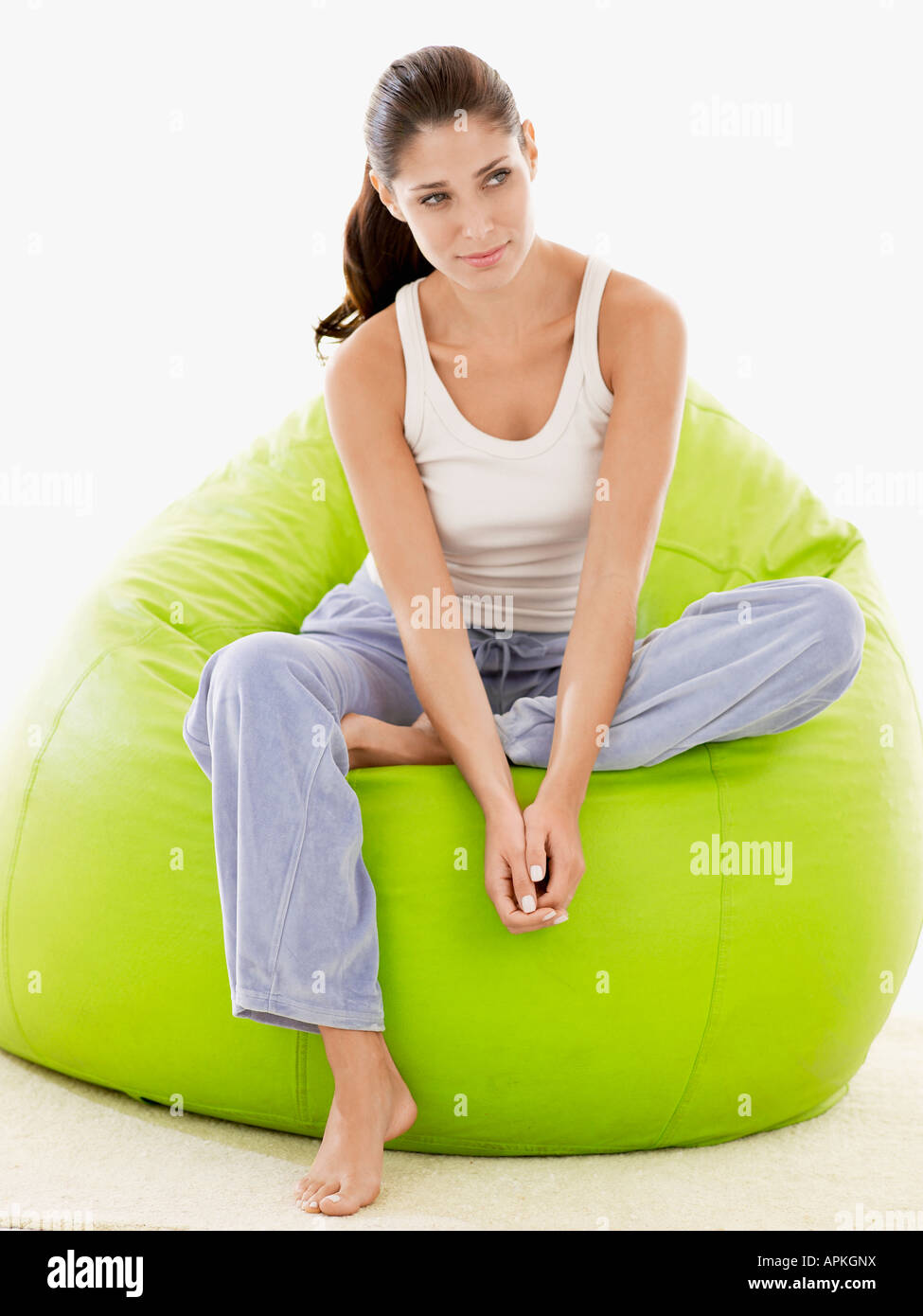 Young woman sitting on beanbag (portrait Stock Photo - Alamy