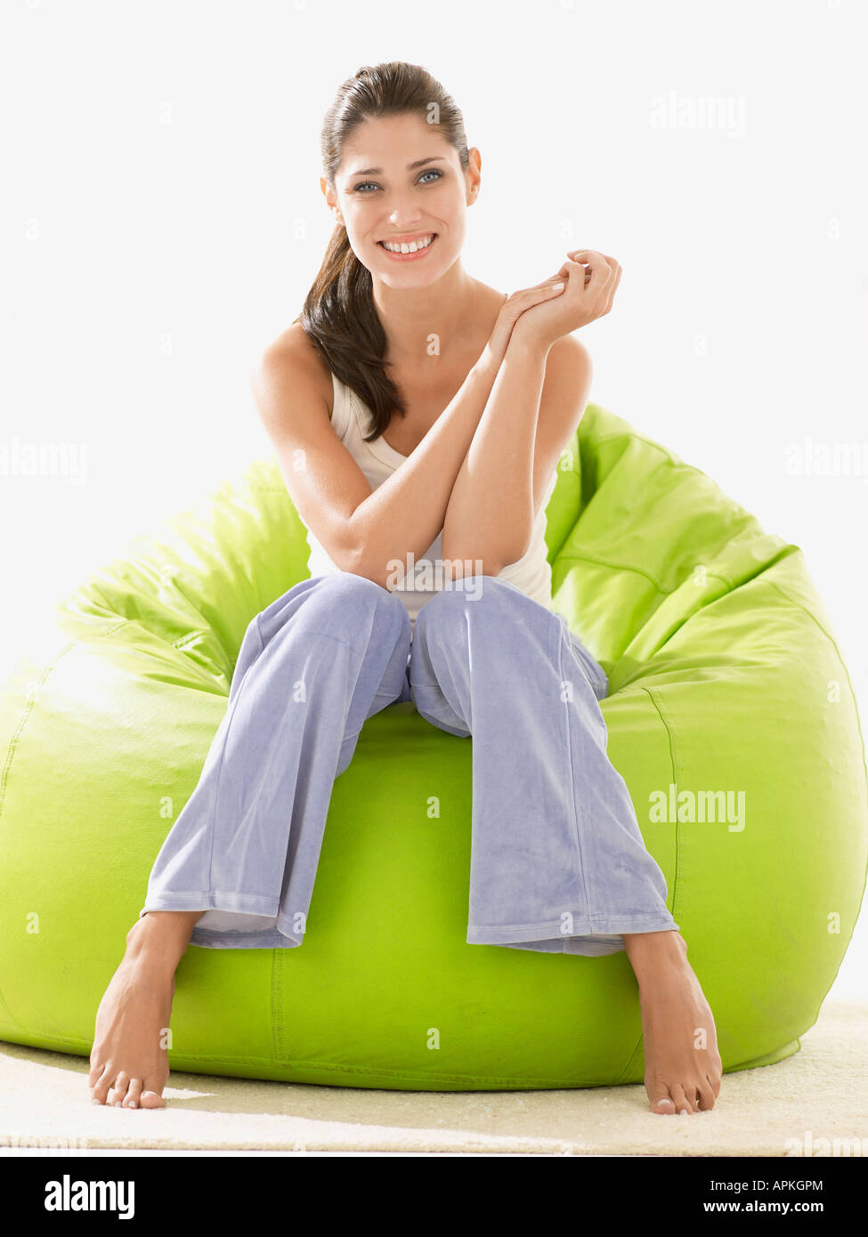 Young woman sitting on beanbag (portrait Stock Photo - Alamy