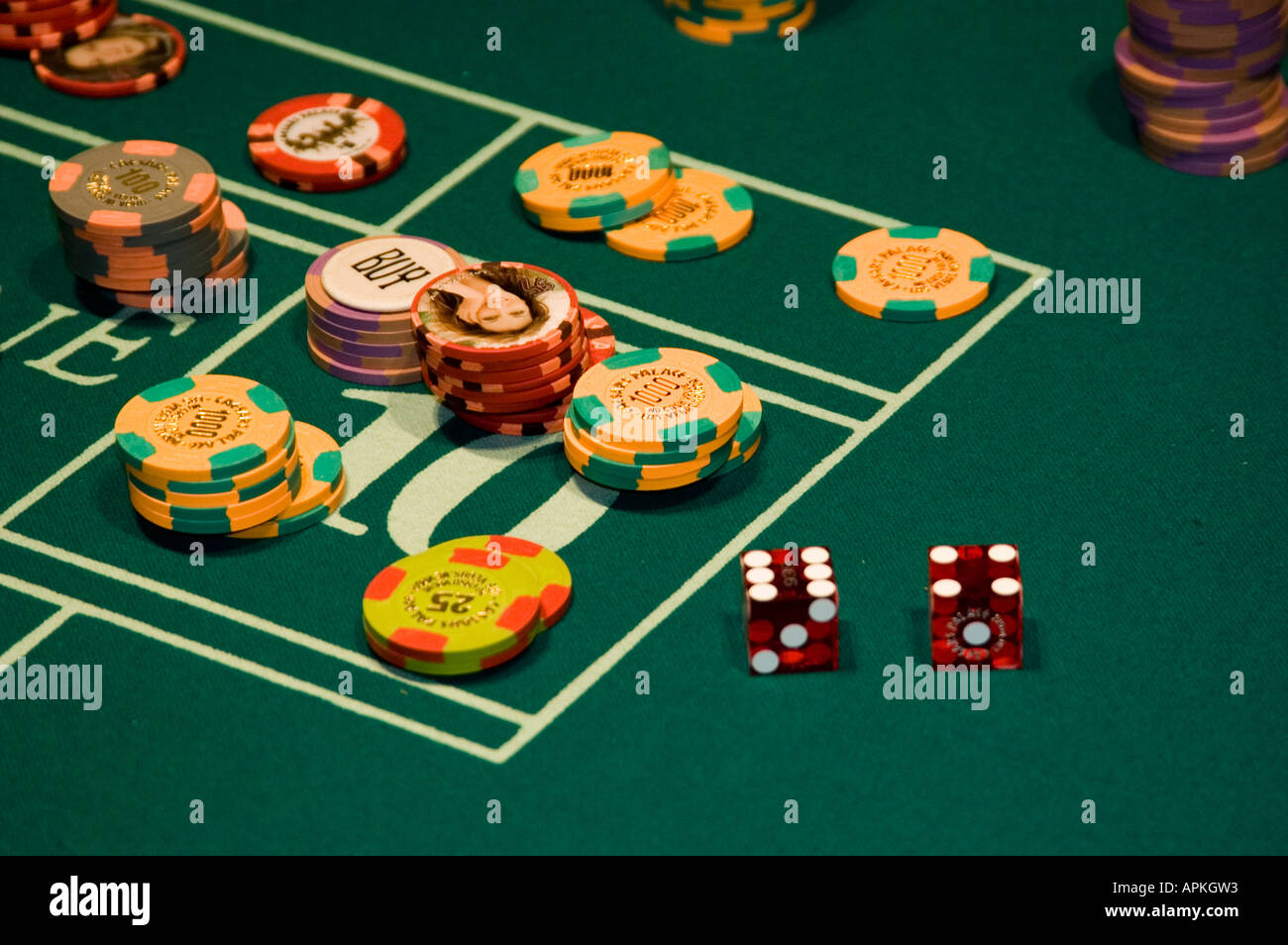 Dice and chips on a craps table in Las Vegas Nevada Caesars Palace and  Casino Stock Photo - Alamy