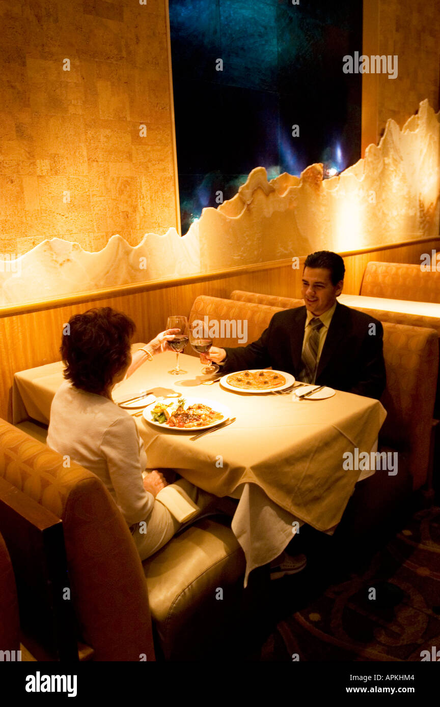 Nevada NV Las Vegas city food drink wine couple restaurant model released Wolfgang Puck's Spago Cafe Forum Shopping Mall Stock Photo