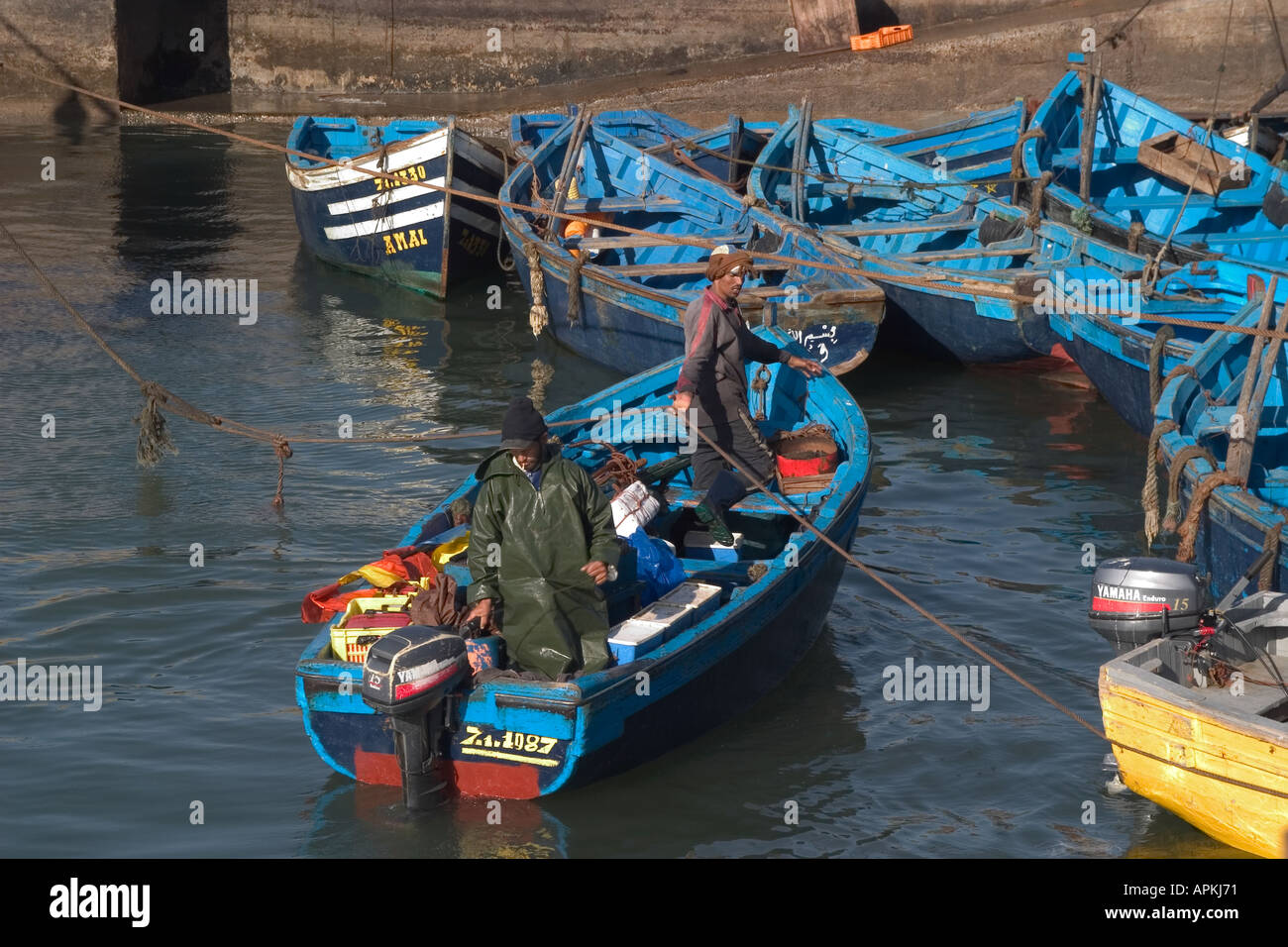 small fishing boat arriving in the harbour essaouira Stock Photo - Alamy
