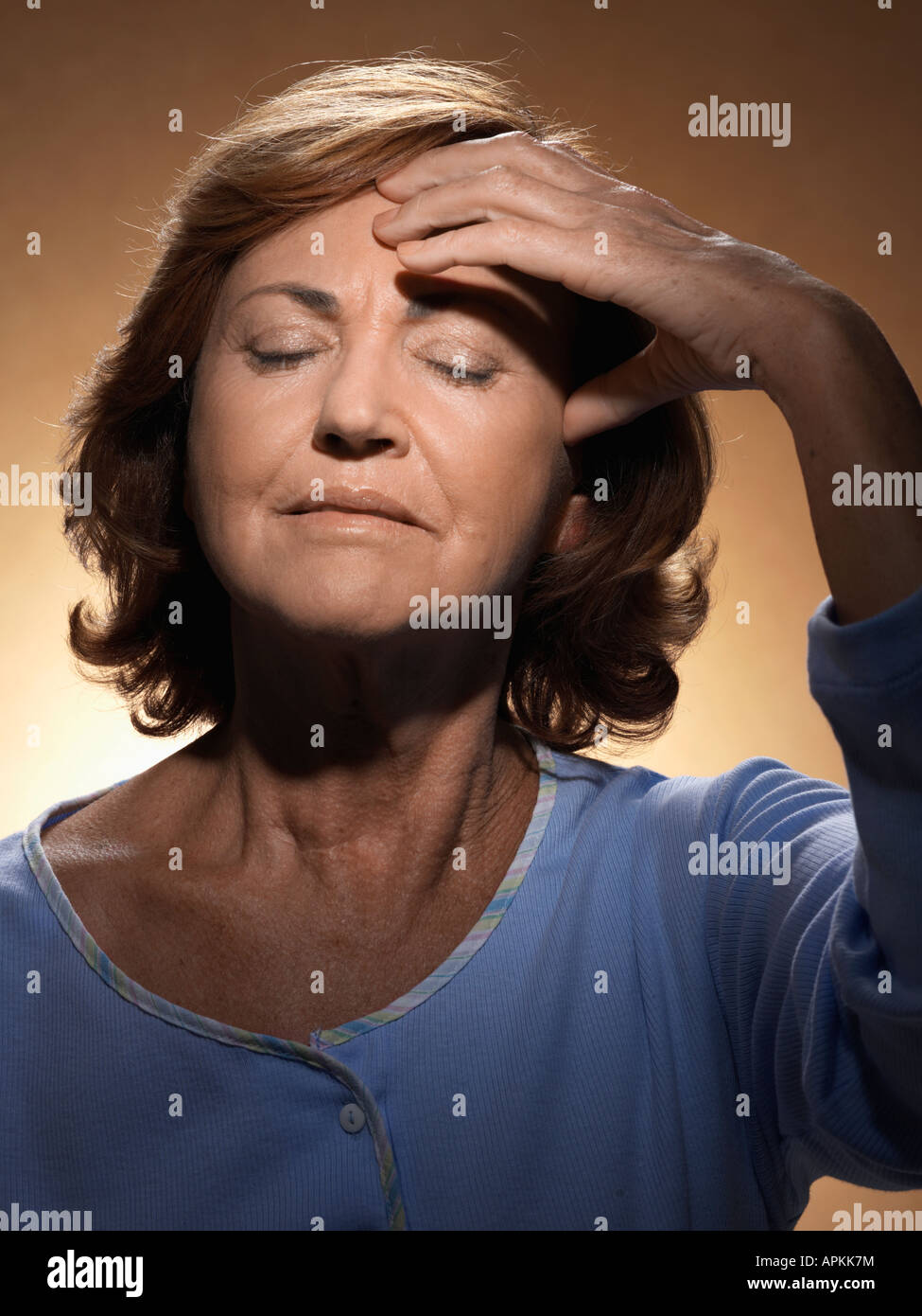 Woman rubbing forehead Stock Photo Alamy