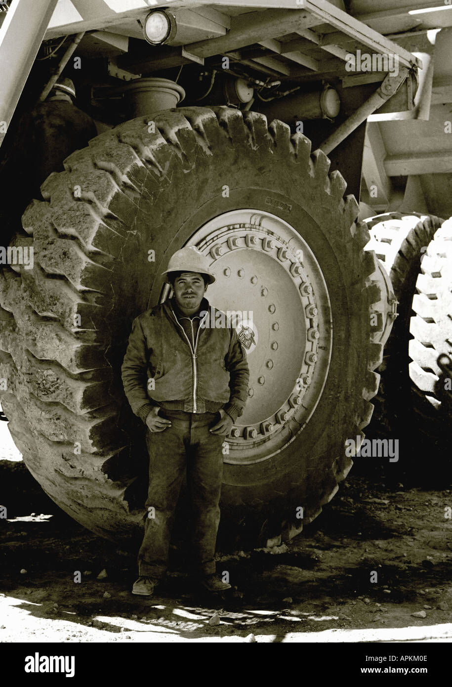 The wheel of a Unirig mining dump truck operating at Peru's Cuajone copper mine in 1973 monochrome photo Stock Photo