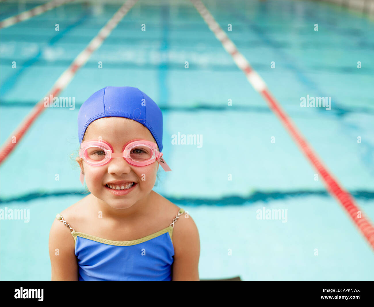 Girl wearing swimming goggles by pool (portrait Stock Photo Alamy