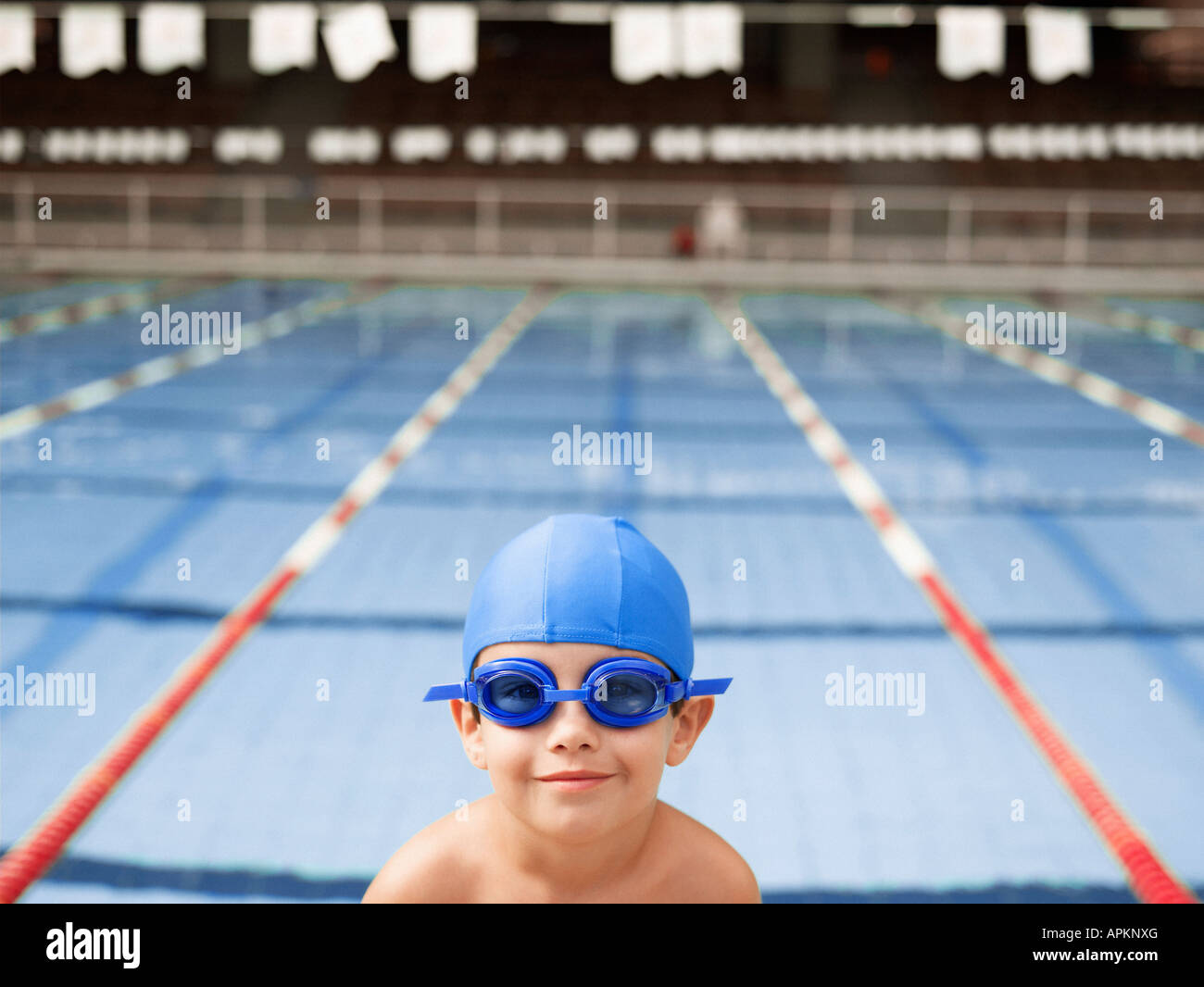 Boy wearing goggles by swimming pool (portrait Stock Photo Alamy