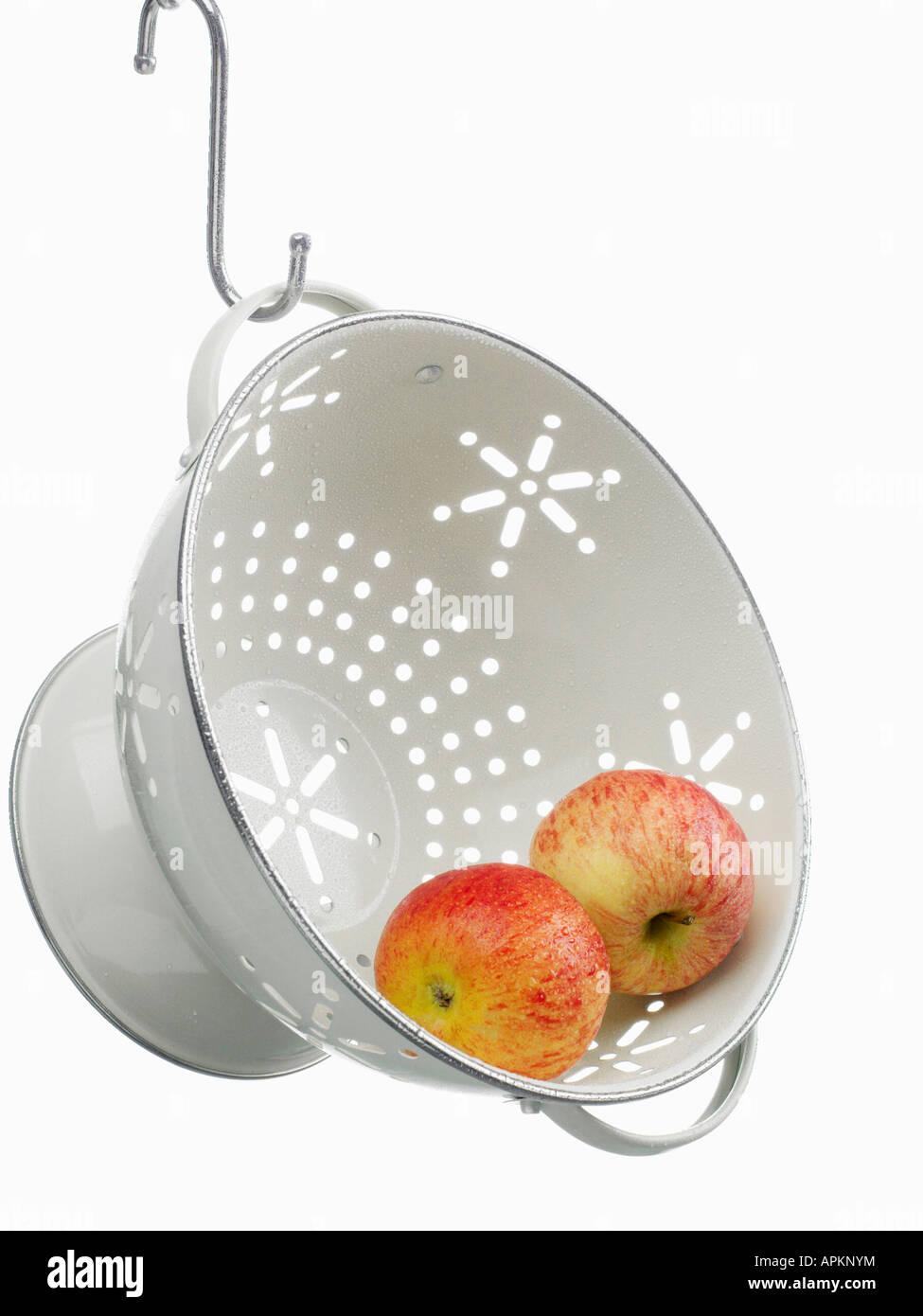 Two apples in colander Stock Photo - Alamy
