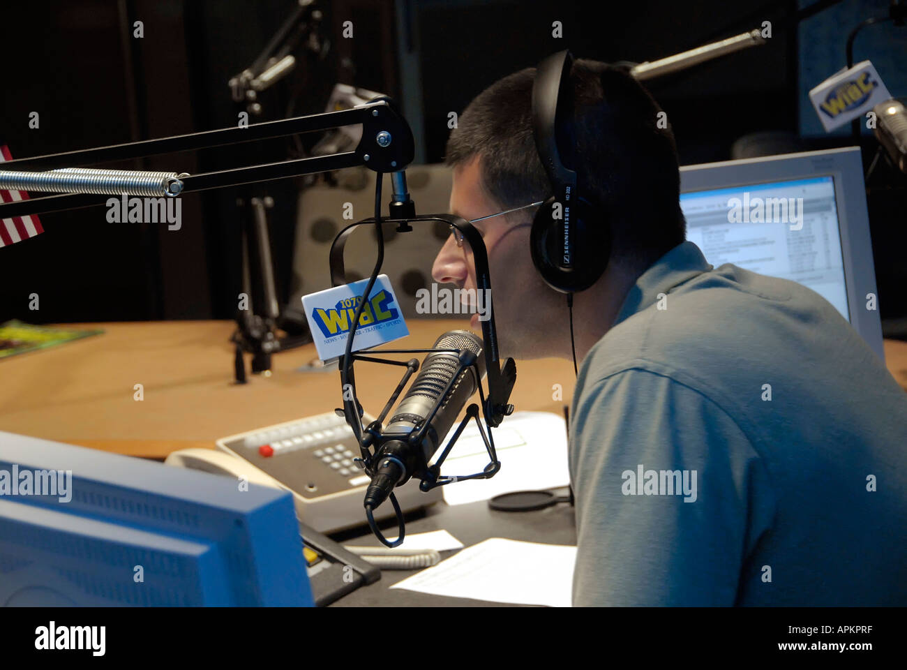 Radio personality gives news weather sports talk and music as a form of entertainment and communication with people Stock Photo
