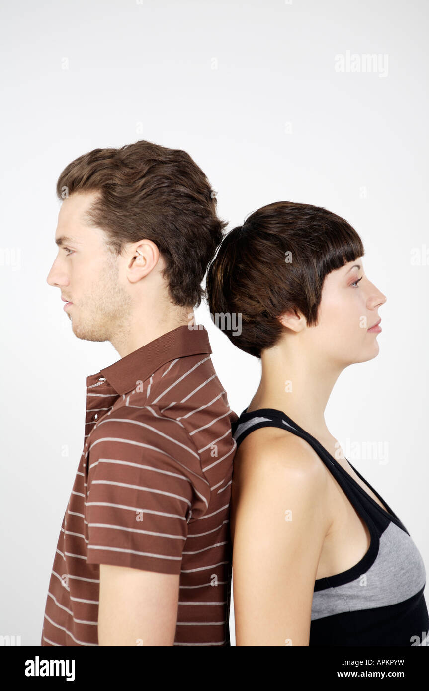 Couple back to back Stock Photo - Alamy