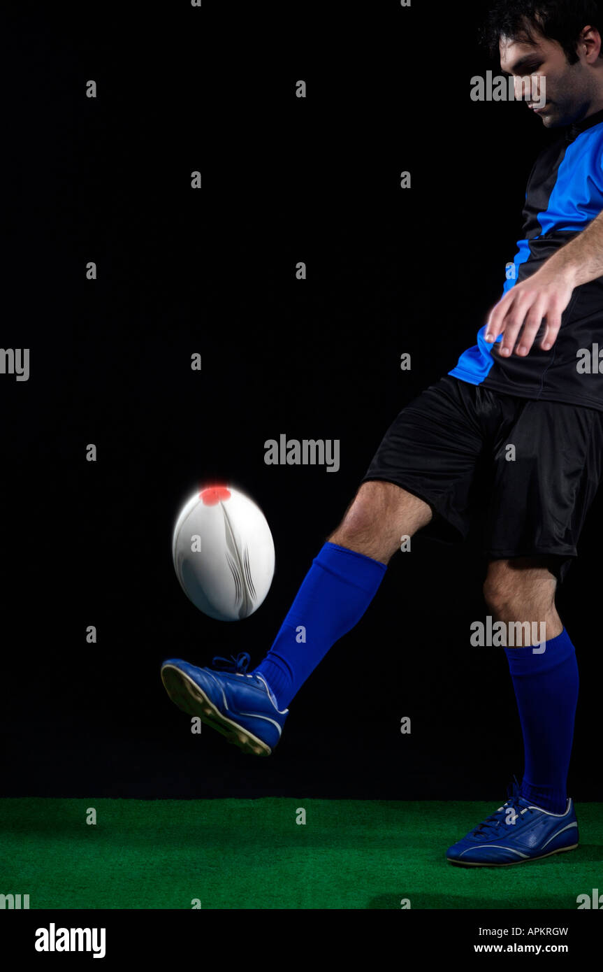 Rugby player with ball Stock Photo