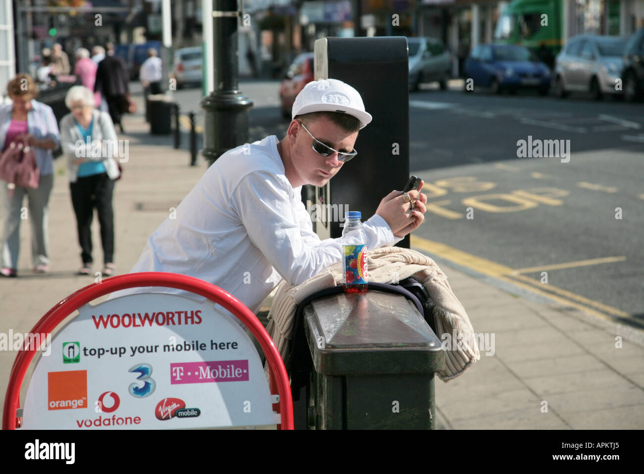 teenager hanging out on high street Stock Photo