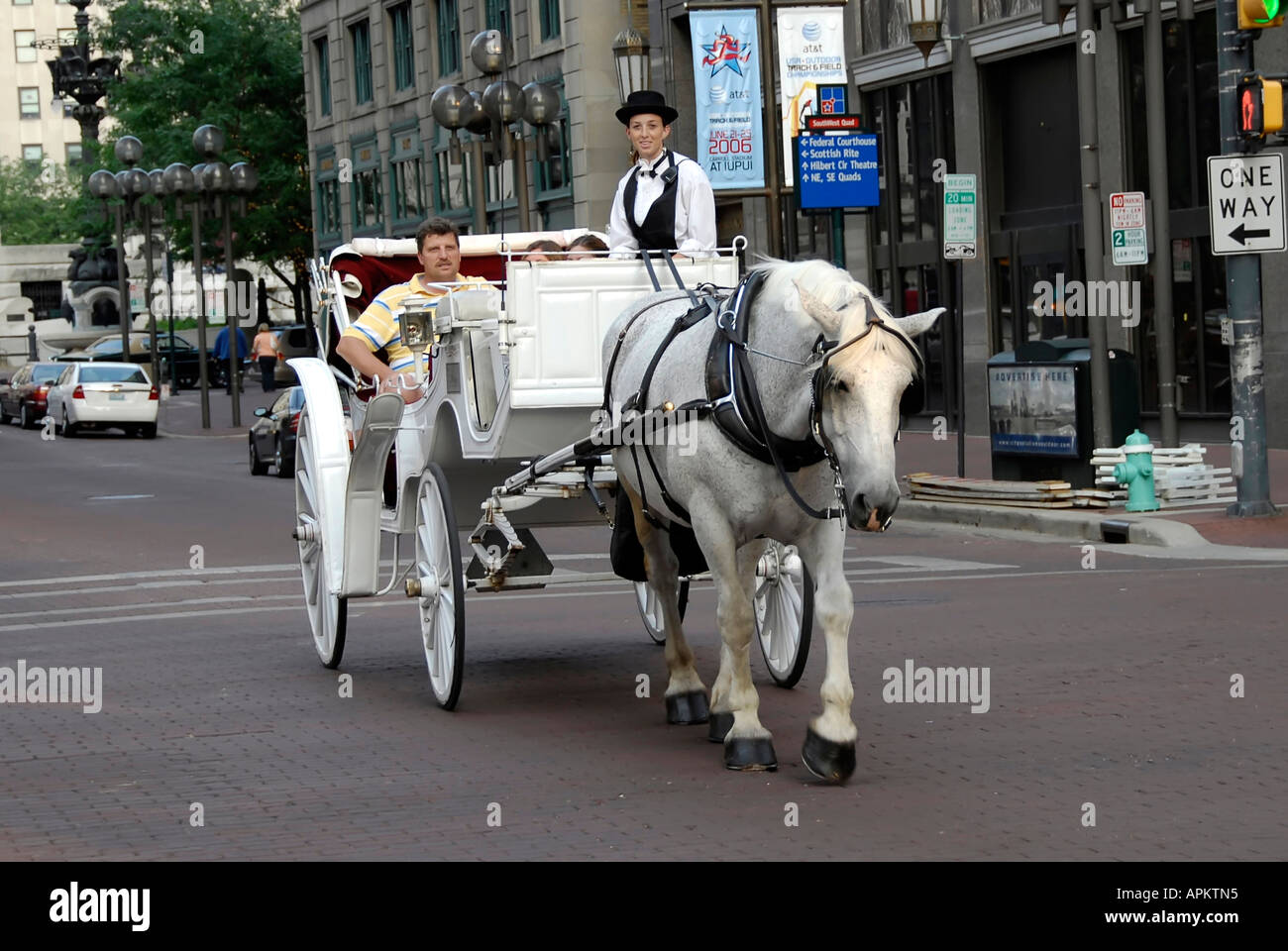 Tourists enjoy ride in a horse drawn carriage in downtown Indianapolis