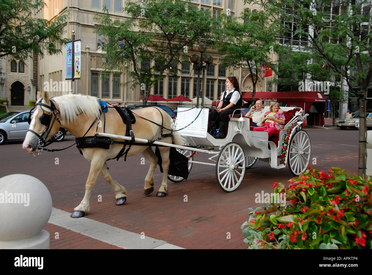 Tourists enjoy ride in a horse drawn carriage in downtown Indianapolis
