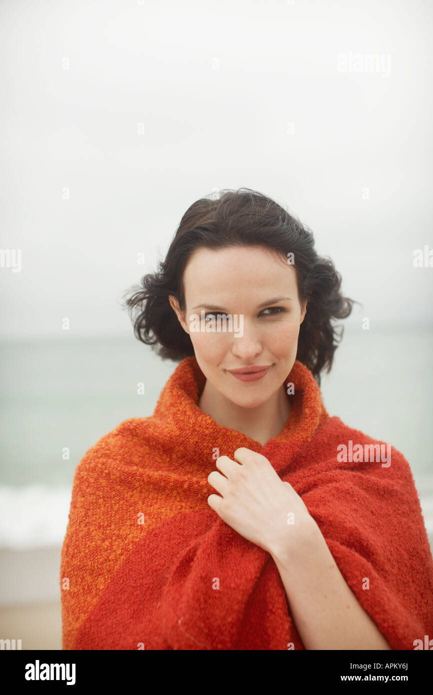Young woman wrapped in towel Stock Photo - Alamy