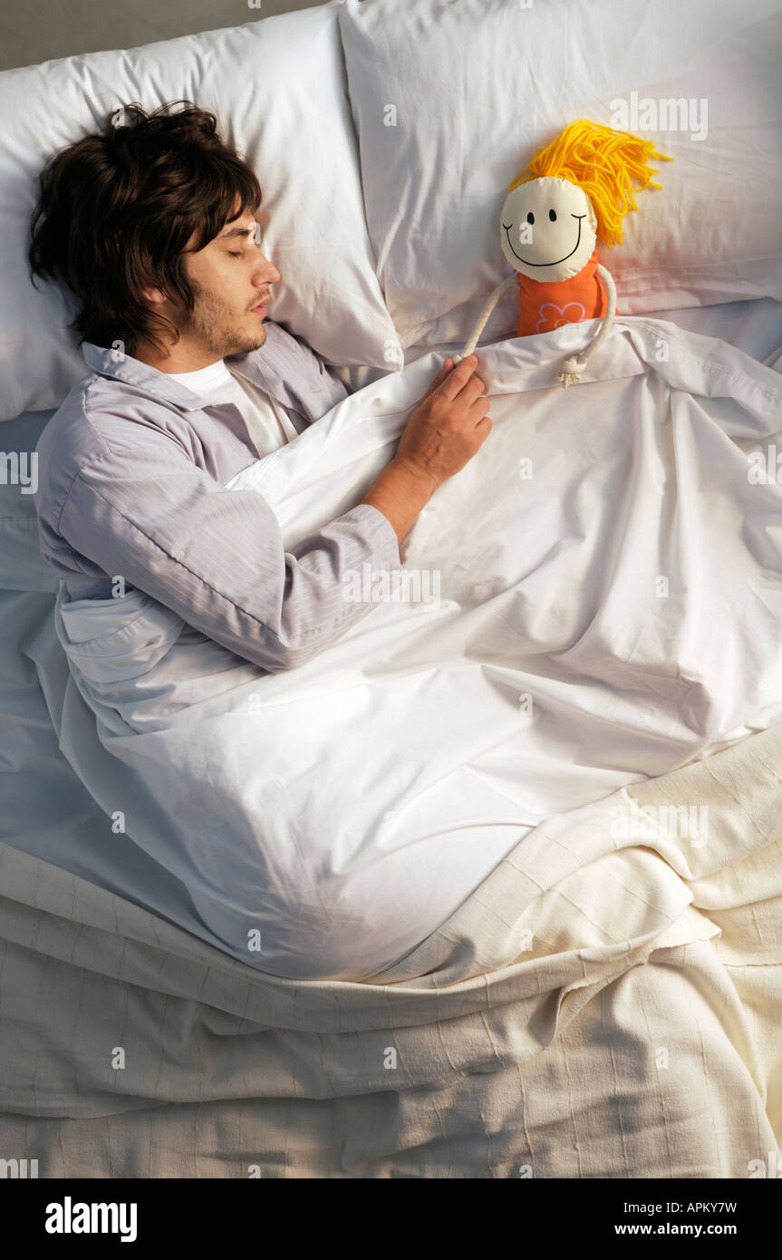 Man in bed Stock Photo