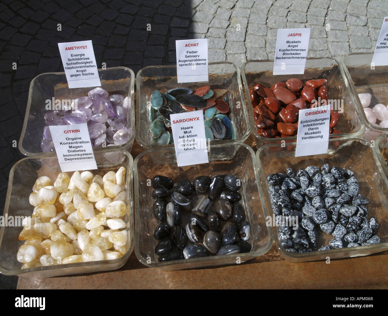 different minerals in glass bowls on a desk Stock Photo Alamy