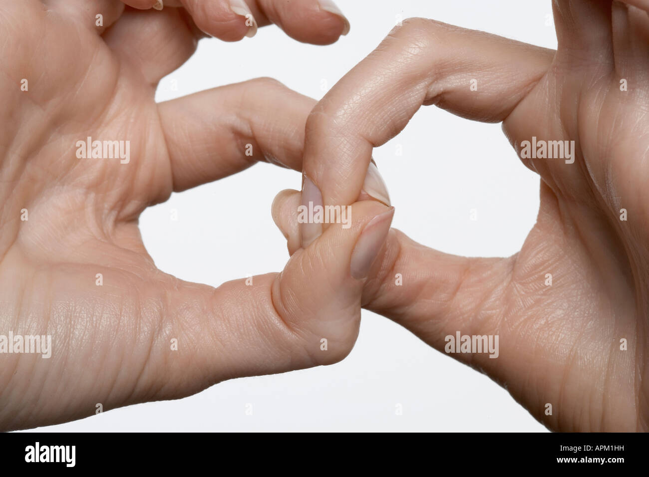 Fingers linked, close-up Stock Photo