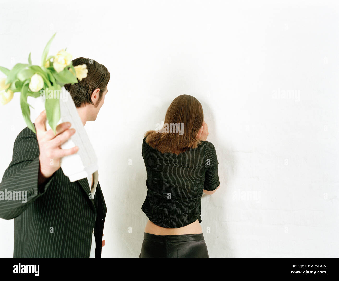 Man throwing flower vase at woman Stock Photo Alamy
