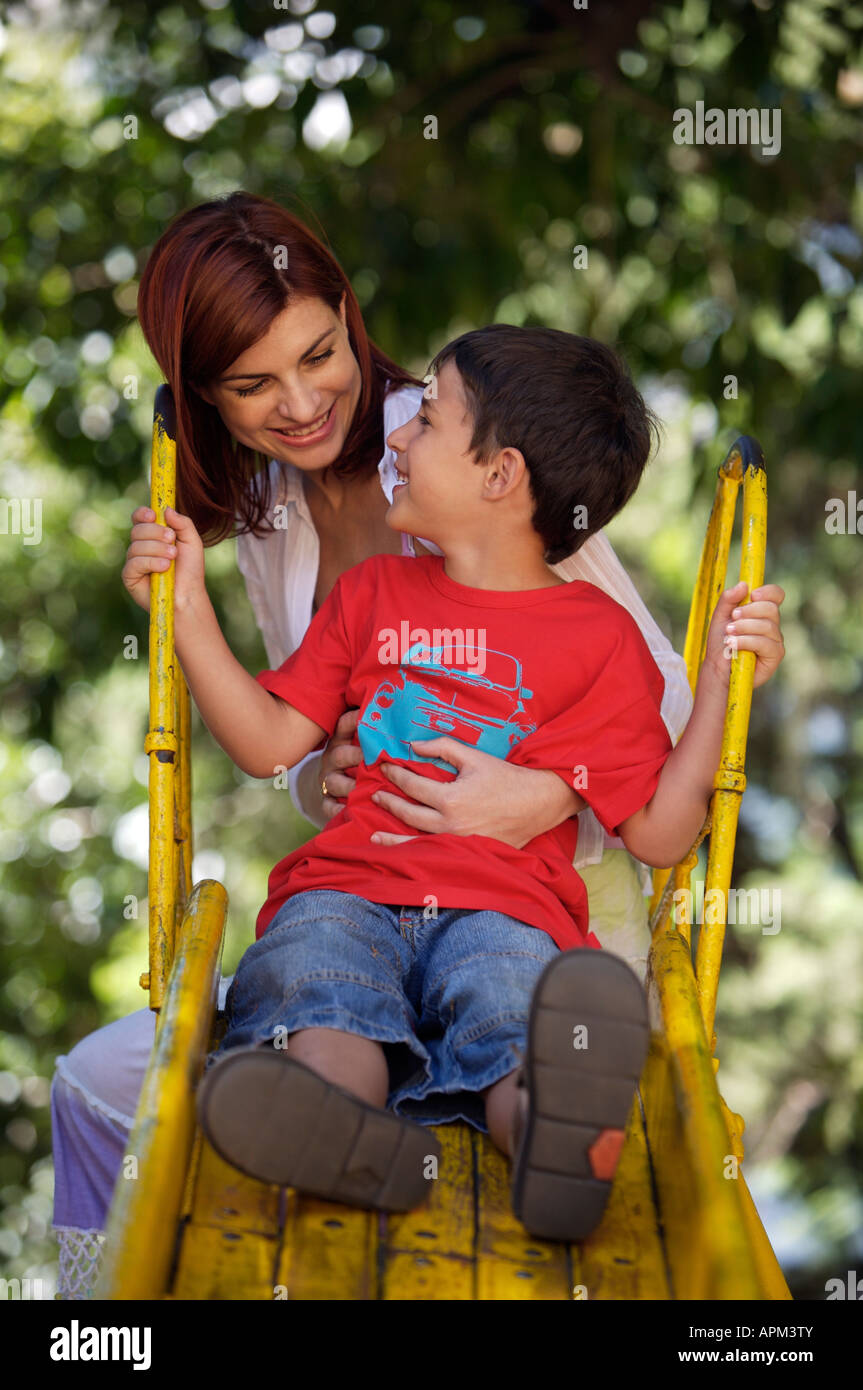 Mother and children in playground Stock Photo