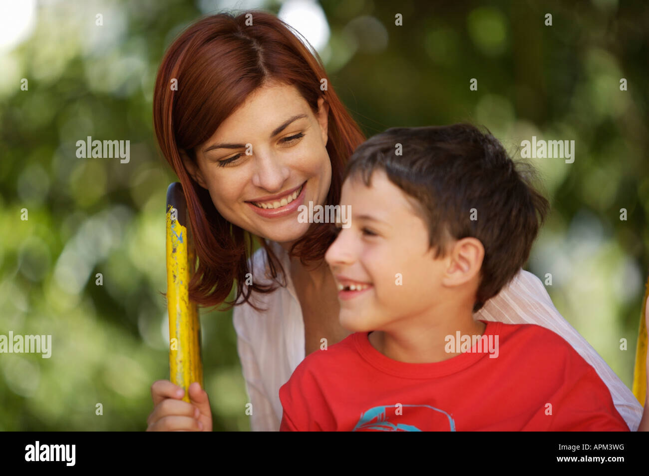 Mother and children in playground Stock Photo