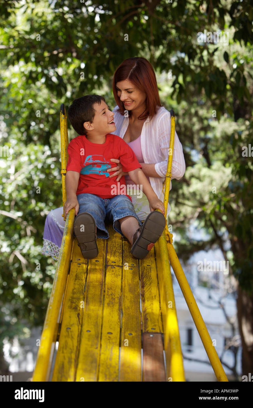 Mother and children in playground Stock Photo
