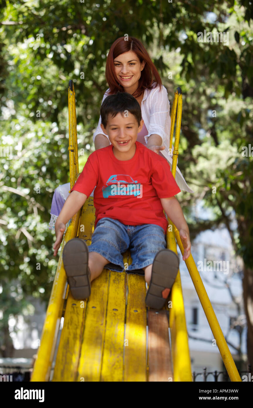 Mother and children in playground Stock Photo