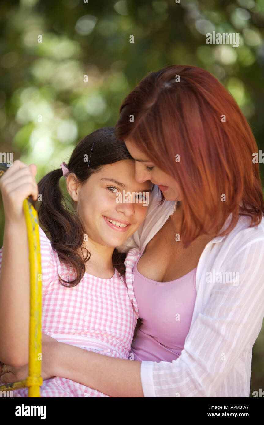 Mother and children in playground Stock Photo