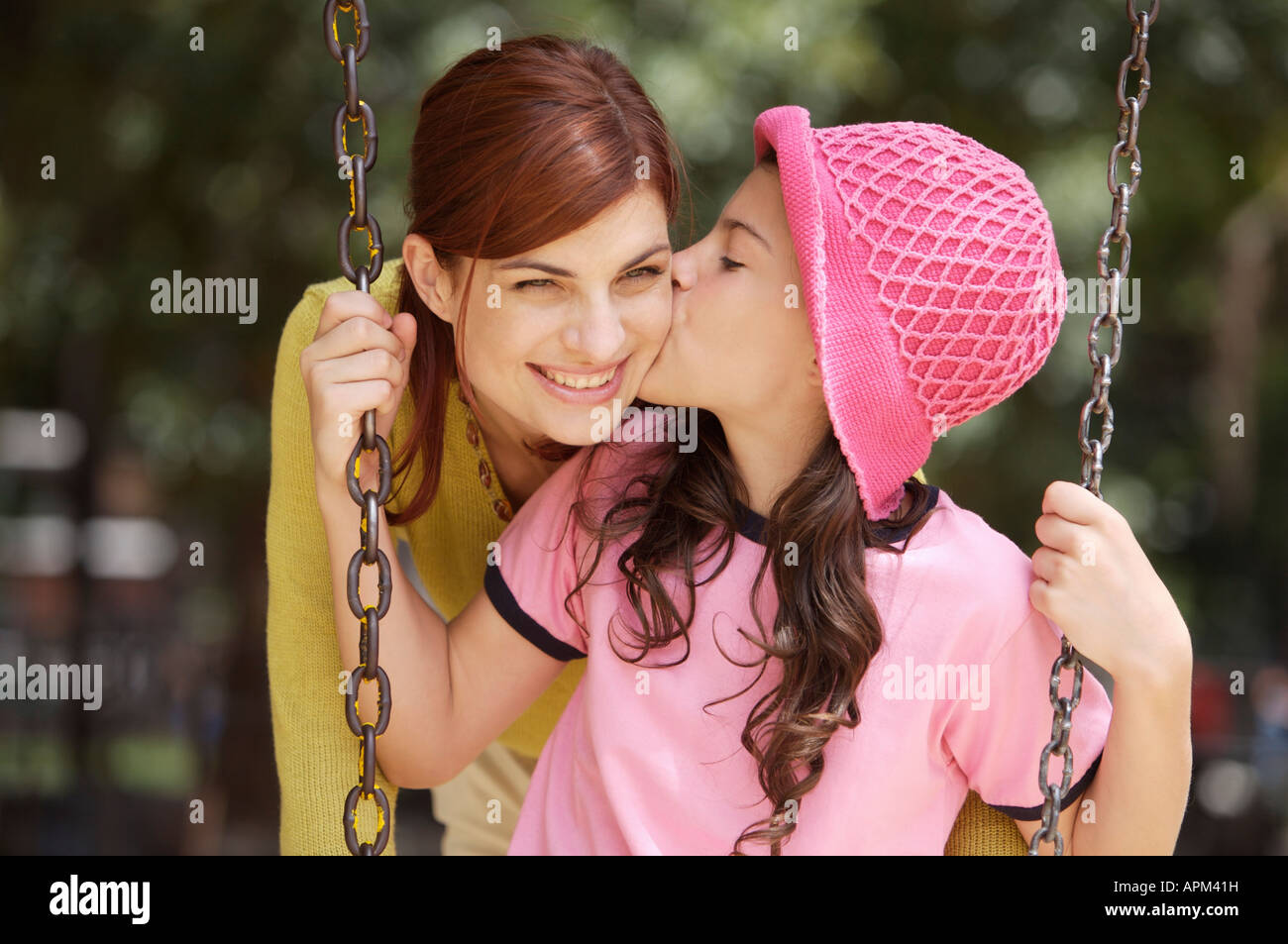 Mother and children in playground Stock Photo