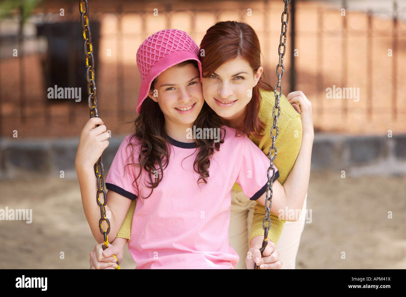 Mother and children in playground Stock Photo