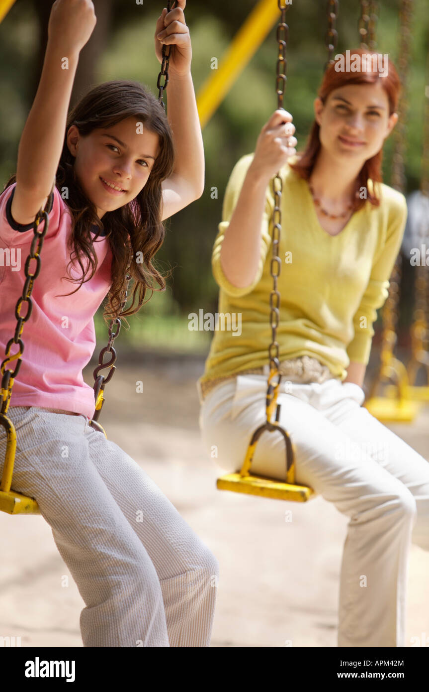 Mother and children in playground Stock Photo