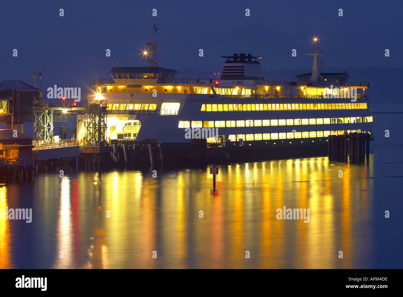 Washington State ferry Puyallup pulling into dock at night Edmonds