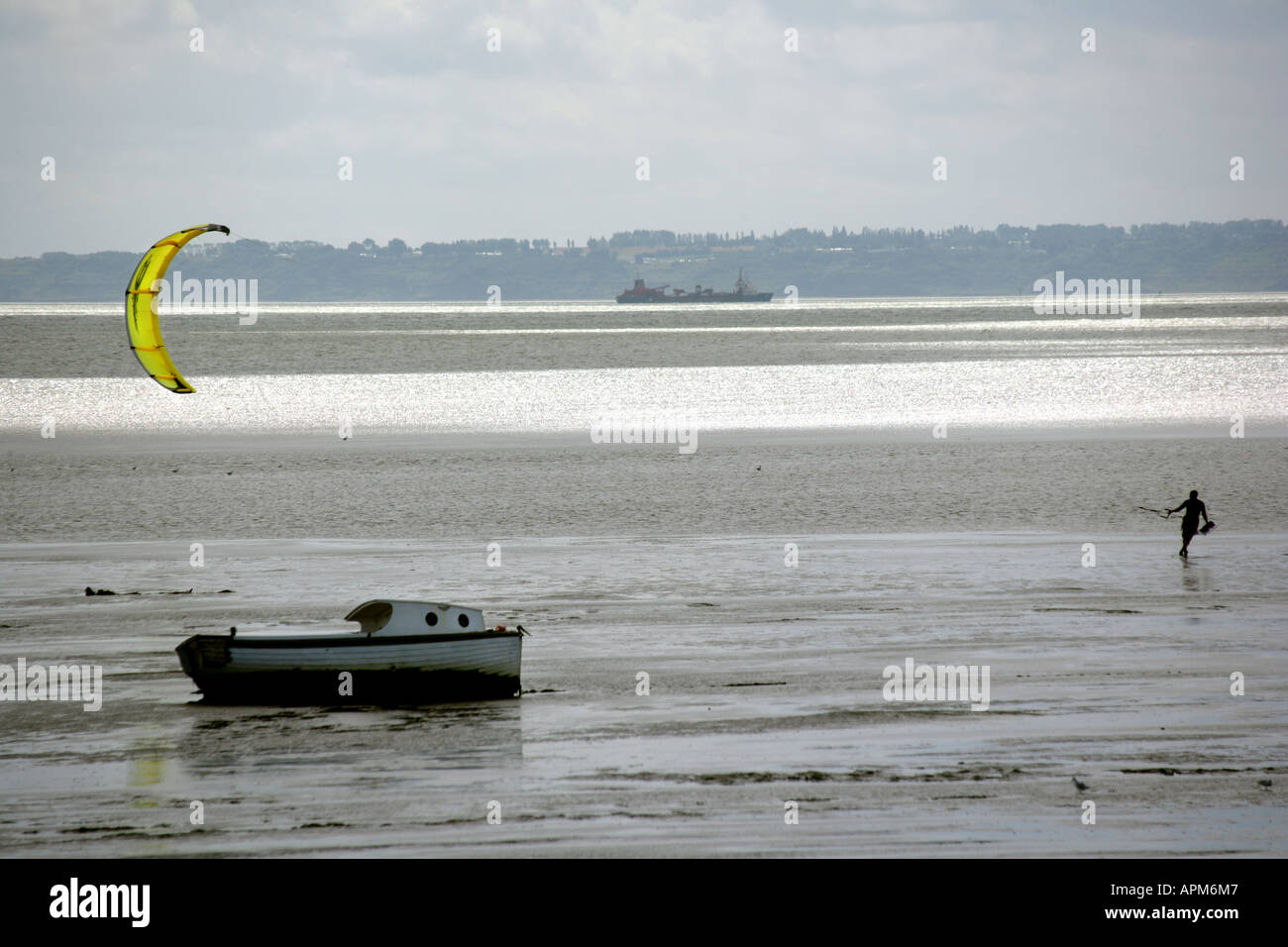 A kite boarding enthusiast making for deeper water Shoebury, Southend on Sea, Essex, England, UK. Stock Photo