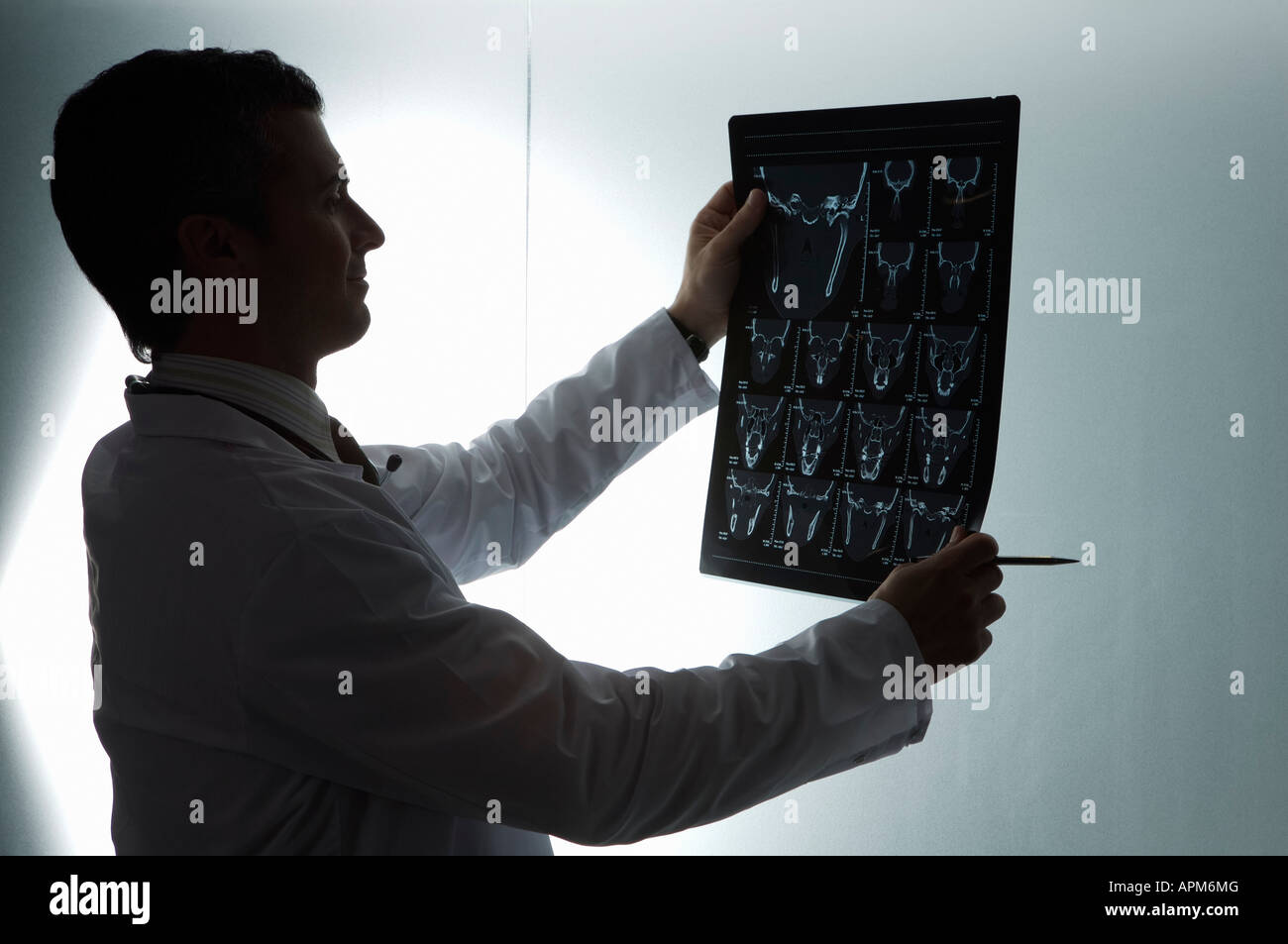 Doctor looking MRI scan Stock Photo Alamy
