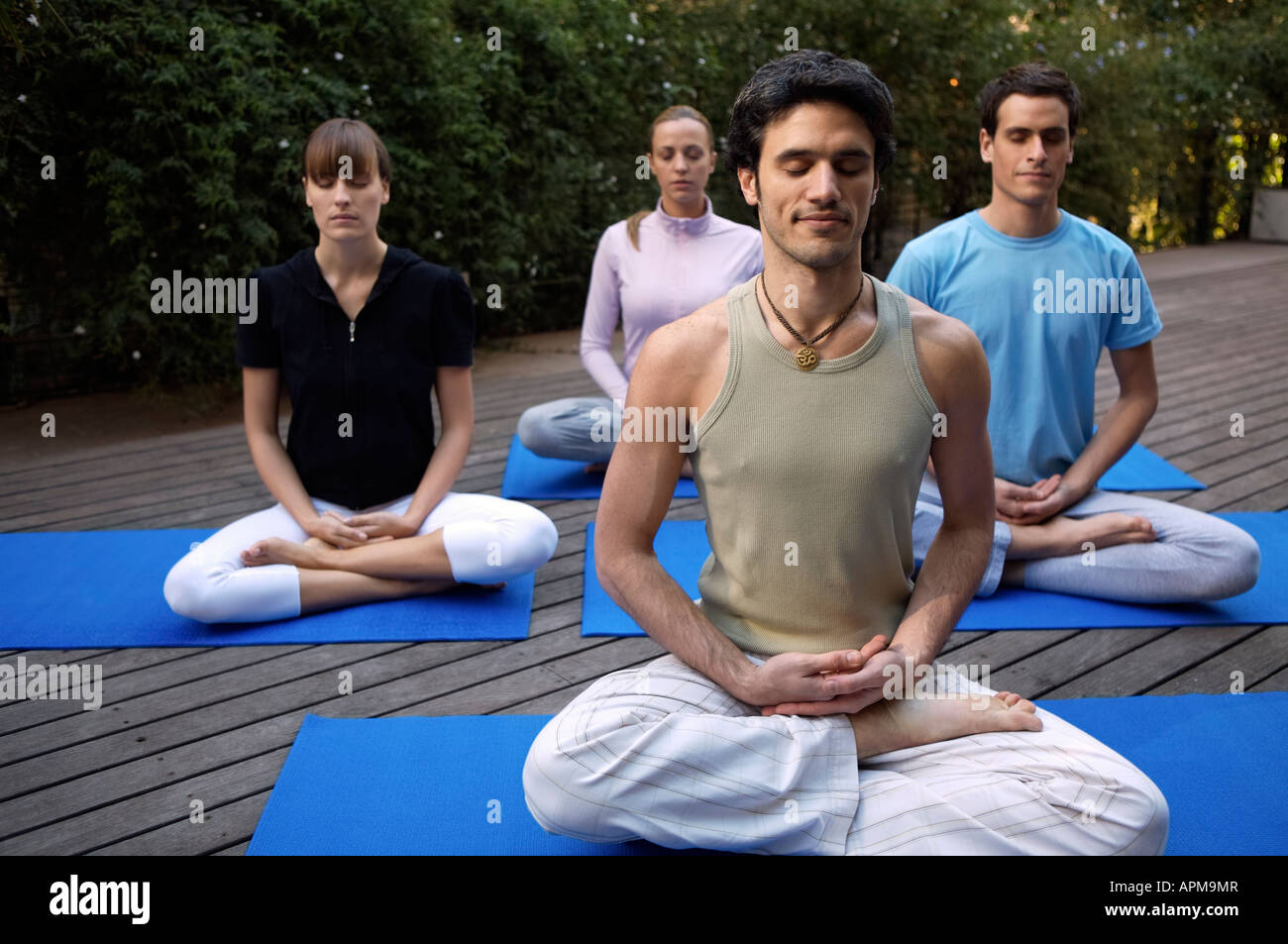 People practicing yoga Stock Photo - Alamy