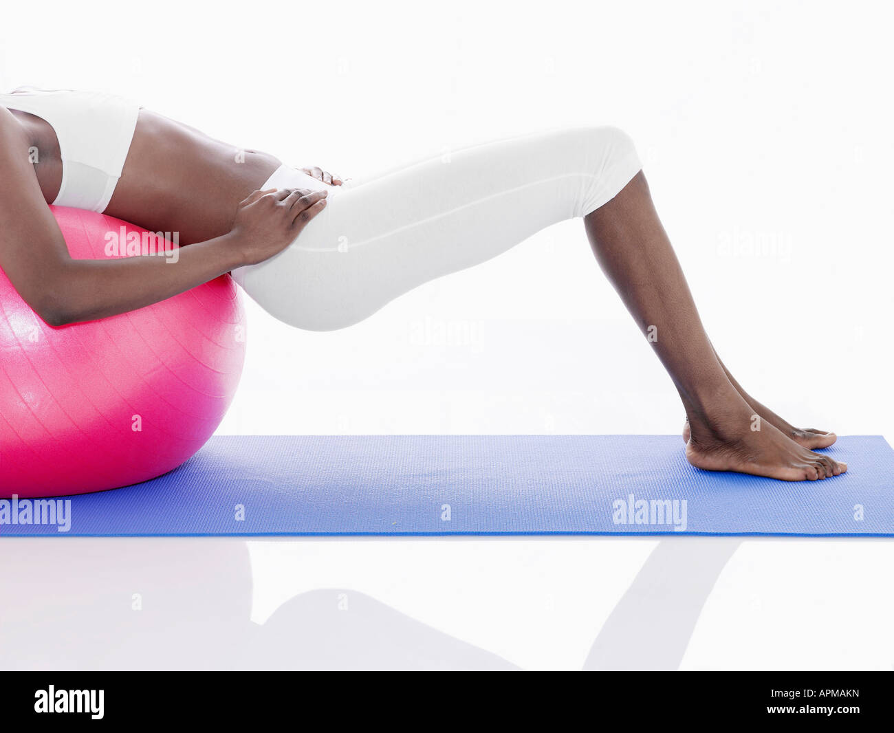 Woman exercising with Swiss ball (low section Stock Photo - Alamy