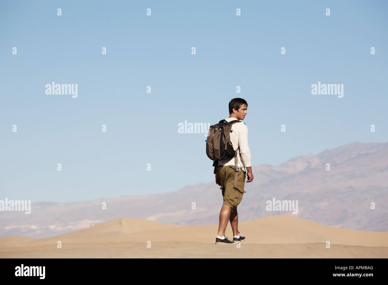 Rear view young male hiker hi-res stock photography and images - Alamy