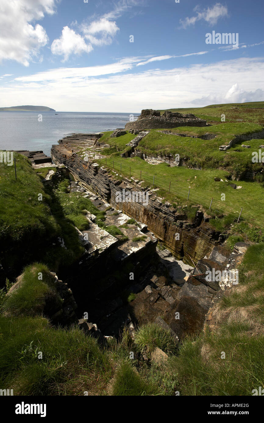 Midhowe Broch iron aged fortified stronghold facing Eynhallow Sound Rousay Isalnd Orkney Scotland UK Stock Photo