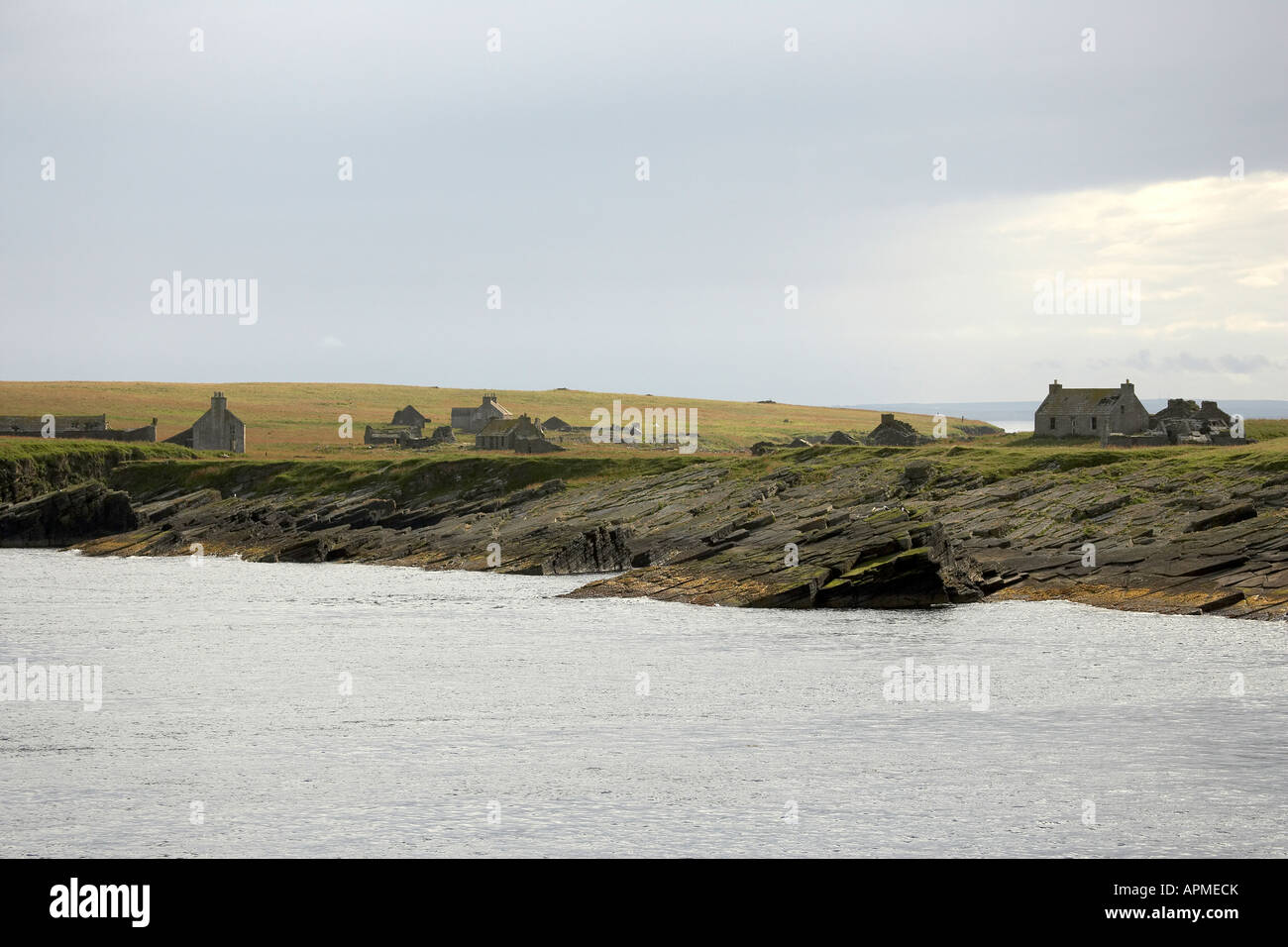 Abandoned cottages on the uninhabited island of Swona Pentland Firth Orkney Scotland UK Stock Photo