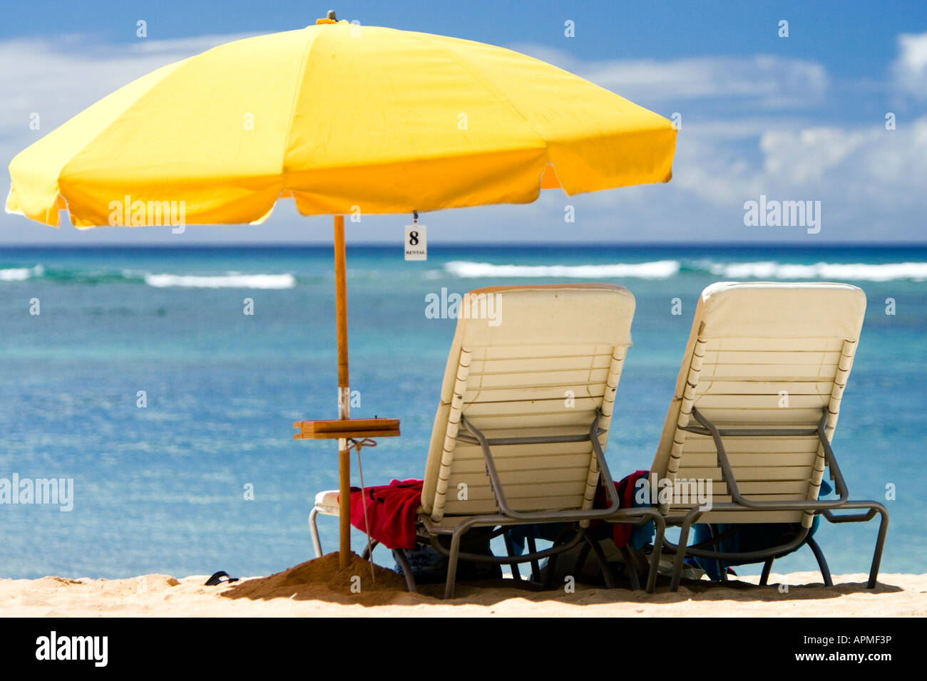 Beach chairs under bright yellow umbrella Waikiki Beach Honolulu Hawaii USA Photo - Alamy