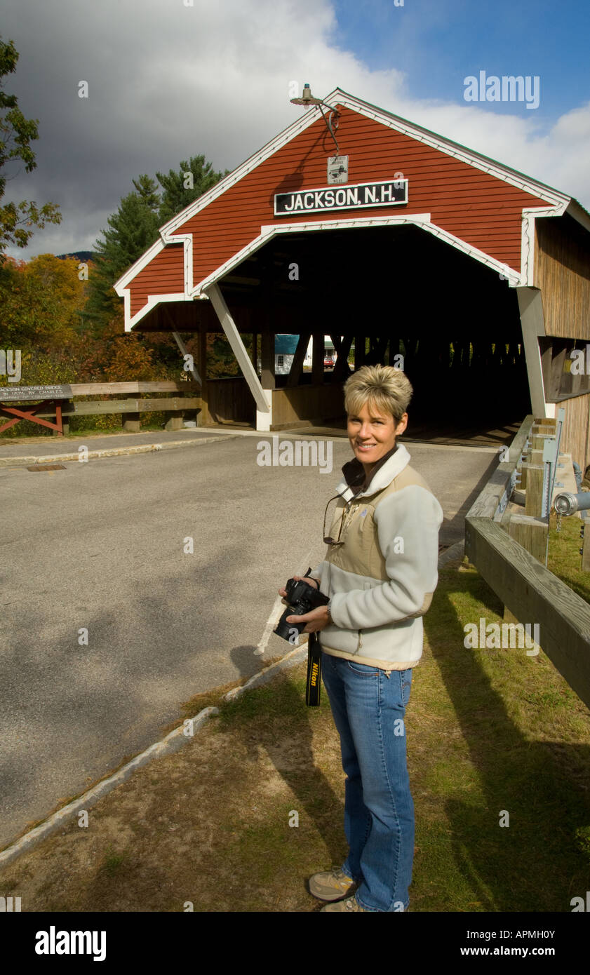 Tourist taking pictures at famous covered bridge in Jackson New
