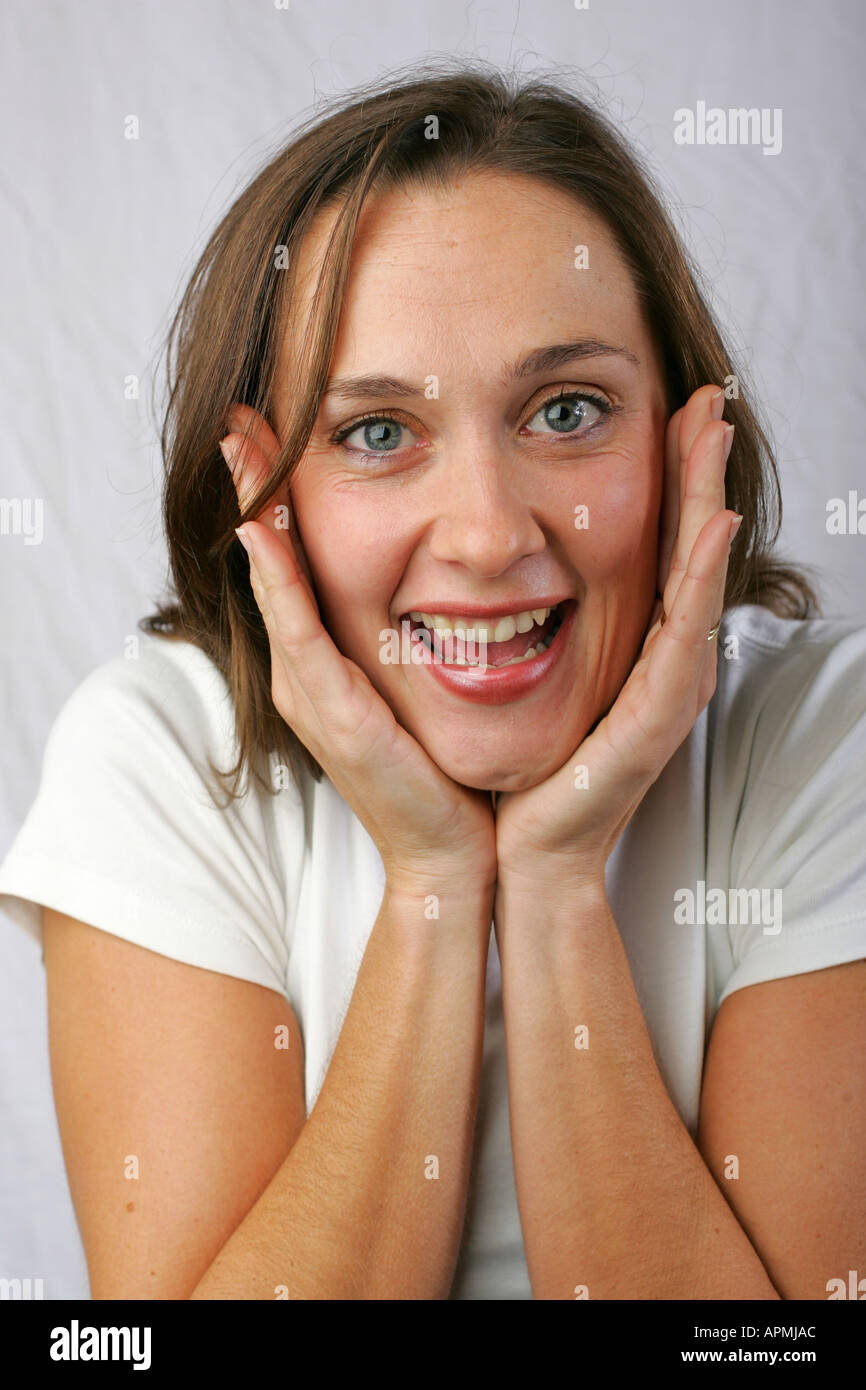 Closeup portrait of a young brunette woman with happy excited expectant ...