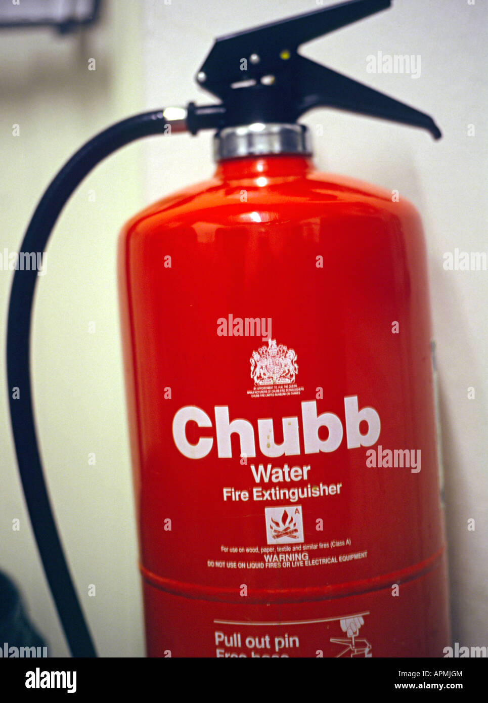 a red fire extinguisher for fires in the uk Stock Photo Alamy