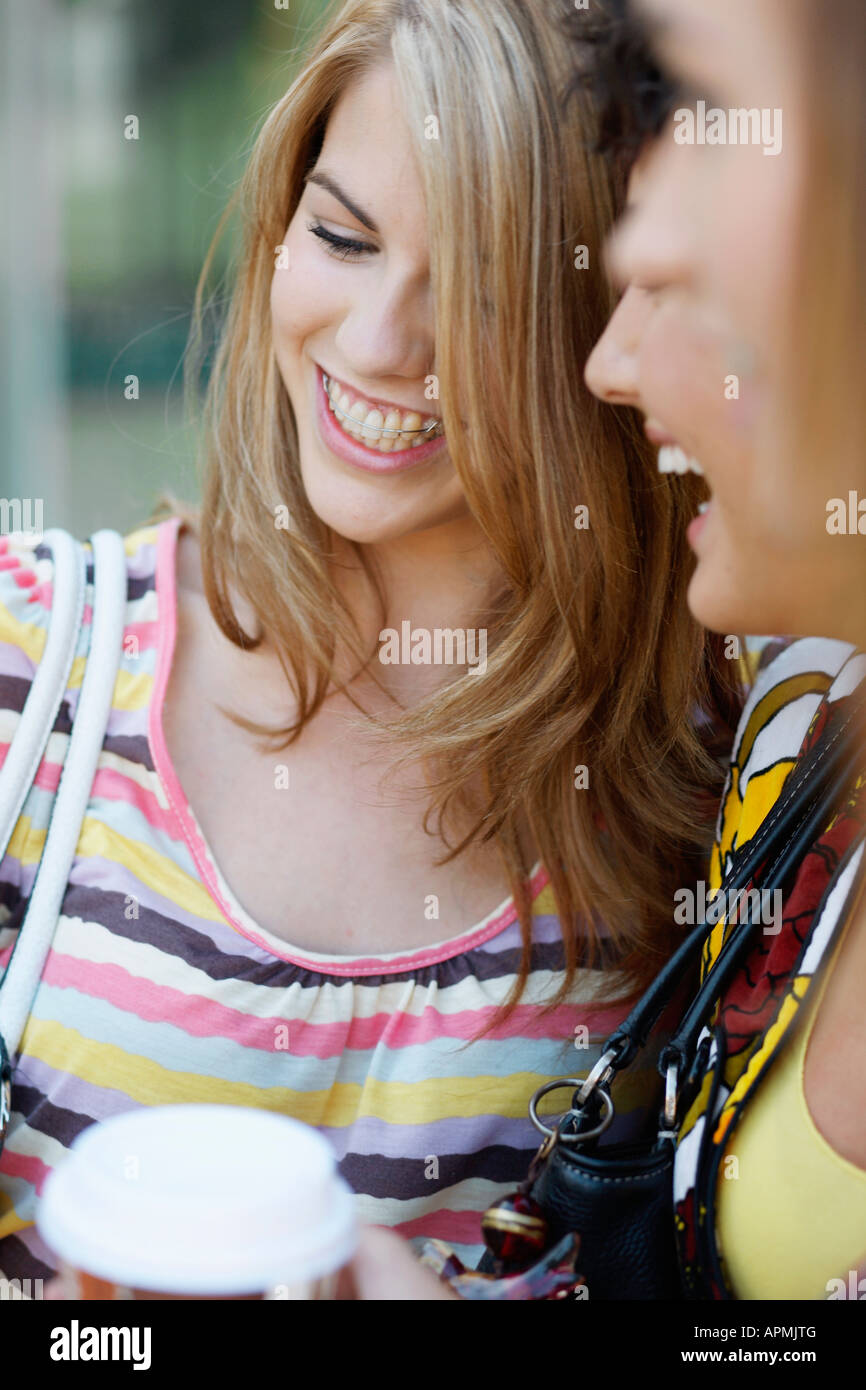 Three young women laughing Stock Photo - Alamy