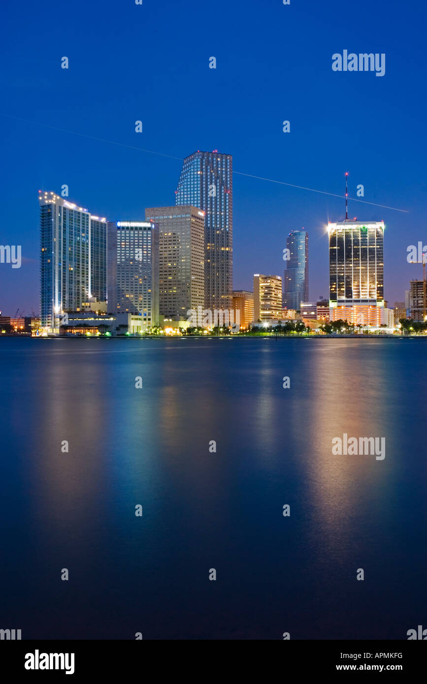 Just before a blue dawn Biscayne Bay reflects high rise buildings Miami ...