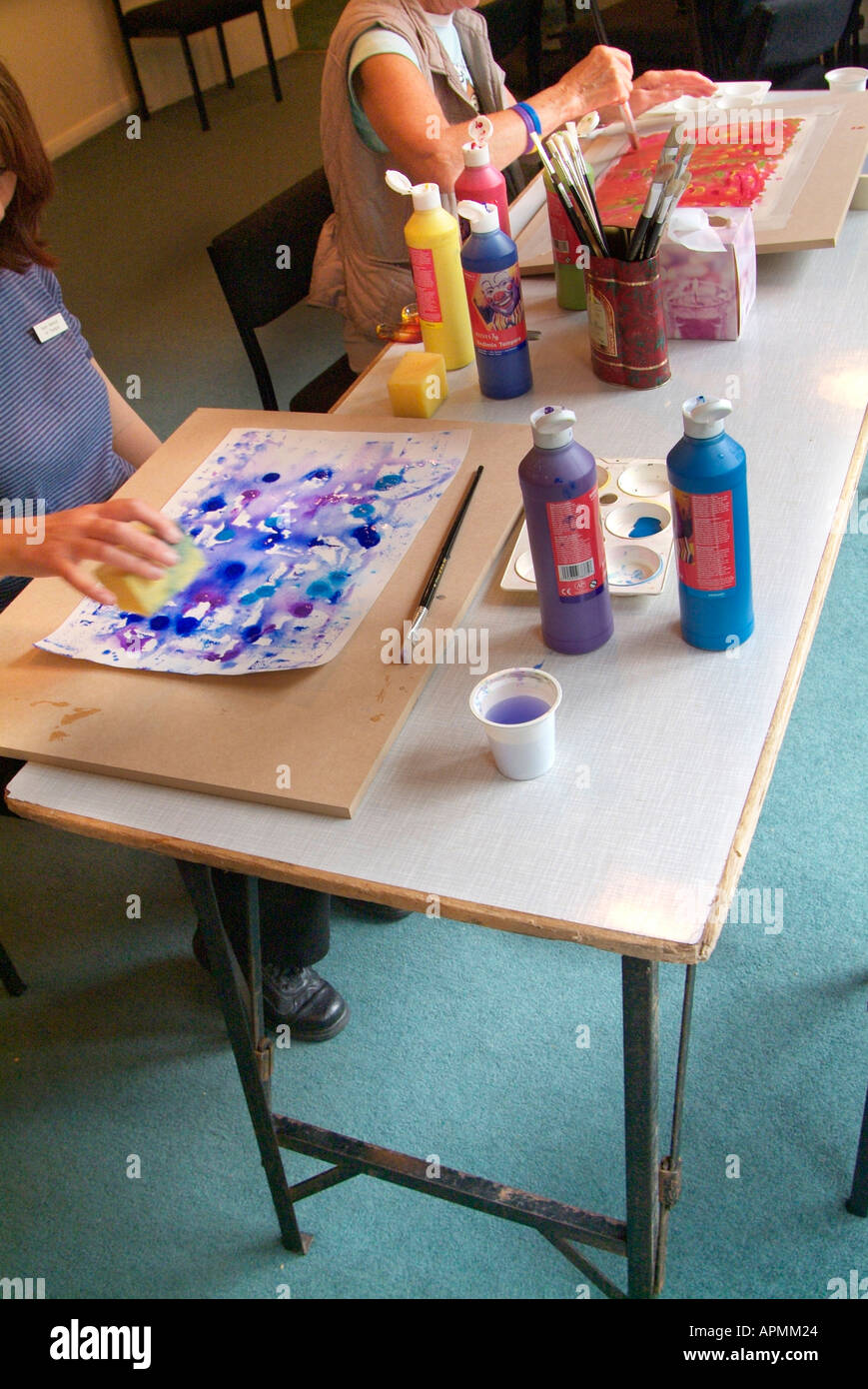 https://c8.alamy.com/comp/APMM24/painting-therapy-workshop-water-colour-color-table-top-drawing-board-APMM24.jpg