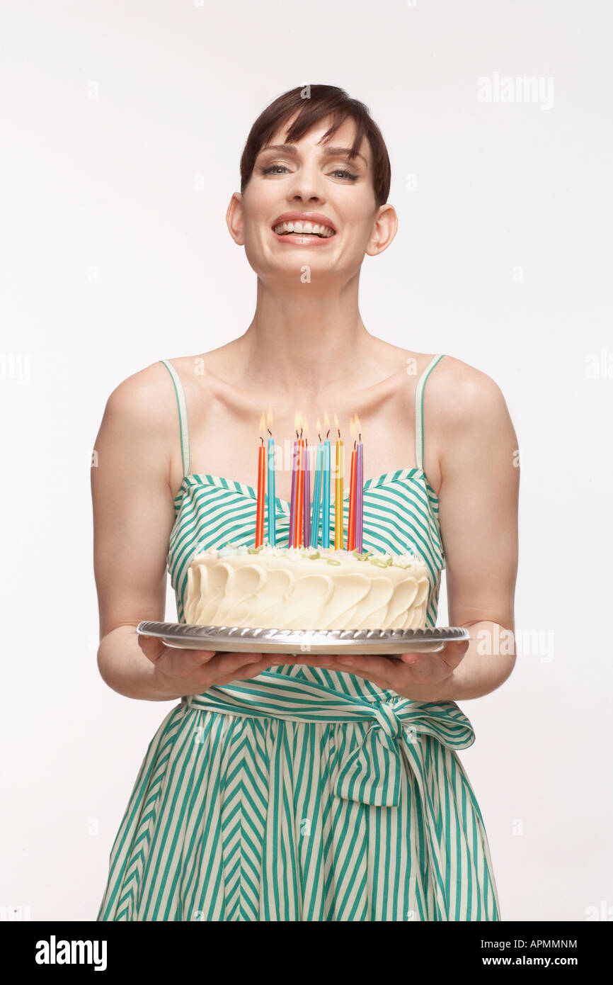 Woman holding birthday cake hi-res stock photography and images - Alamy