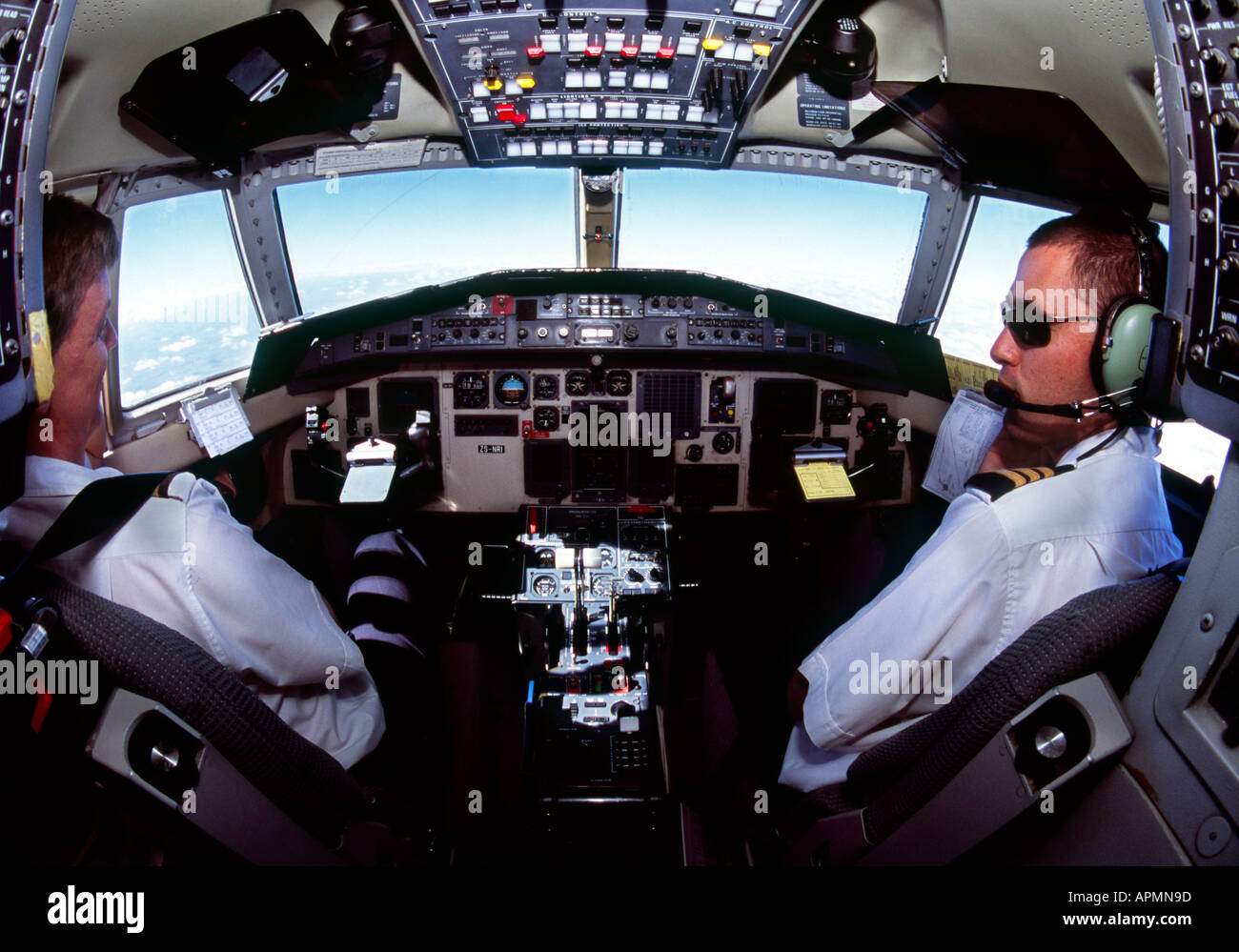 Cockpit view of Jetstream 41 turboprop aircraft with pilot and co-pilot flying the aircraft. Stock Photo