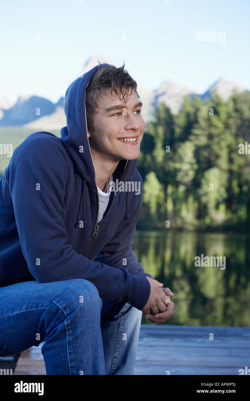 Teenage boy by lake, Cape Town, South Africa Stock Photo