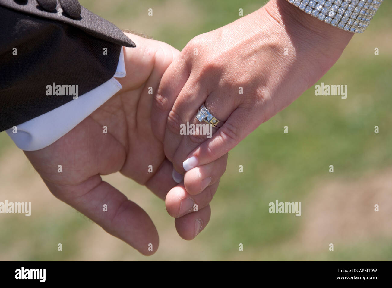 NEWLYWEDS HOLDING HANDS Stock Photo - Alamy
